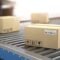 Logistics conveyor systems moving boxes in an automated warehouse conveyor system